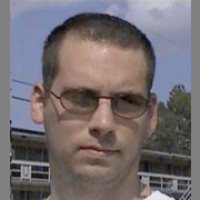 Morgan Prescott Man with close-cropped dark hair wearing sunglasses